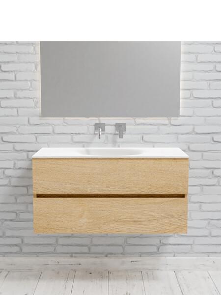 Mueble de baño 100 cm Wood roble natural con 2 cajones, lavabo de Solid surface seno centrado con 0 orificio(s) para el grifo. 11 Mueble de baño suspendido Vica 100 Wood roble natural 2 cajones en acabado Wood roble natural mate. Un mueble de baño de apertura suave por uñero con encimera para grifo empotrado y seno centrado.