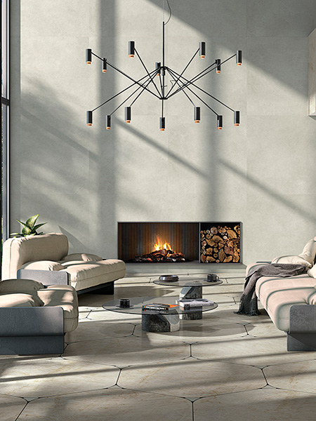 salón moderno con suelo porcelánico efecto piedra natural en piezas irregulares y chimenea