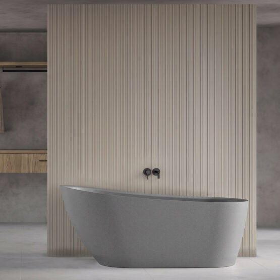 Bañera exenta Wavy de Fiora en Grey Dot en un baño contemporáneo
