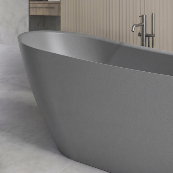 Bañera exenta Wavy Mini de Fiora en Grey Dot en un baño contemporáneo